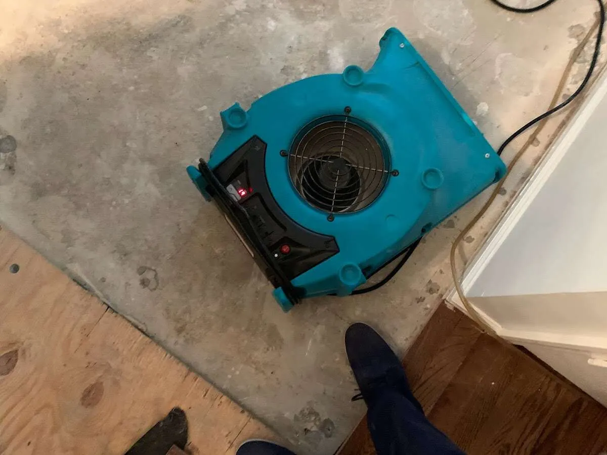Air mover drying subfloor during Commercial Water Damage Restoration in Mineral Wells
